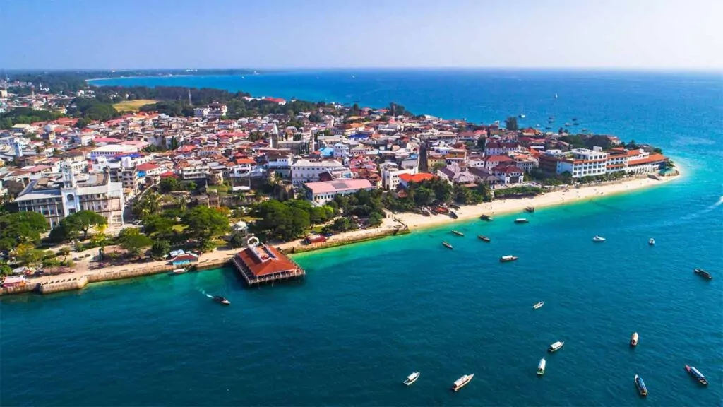 Aerial view of Stone Town, Zanzibar with its coastline and turquoise waters.